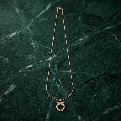 Bow Pendant - worn/model view