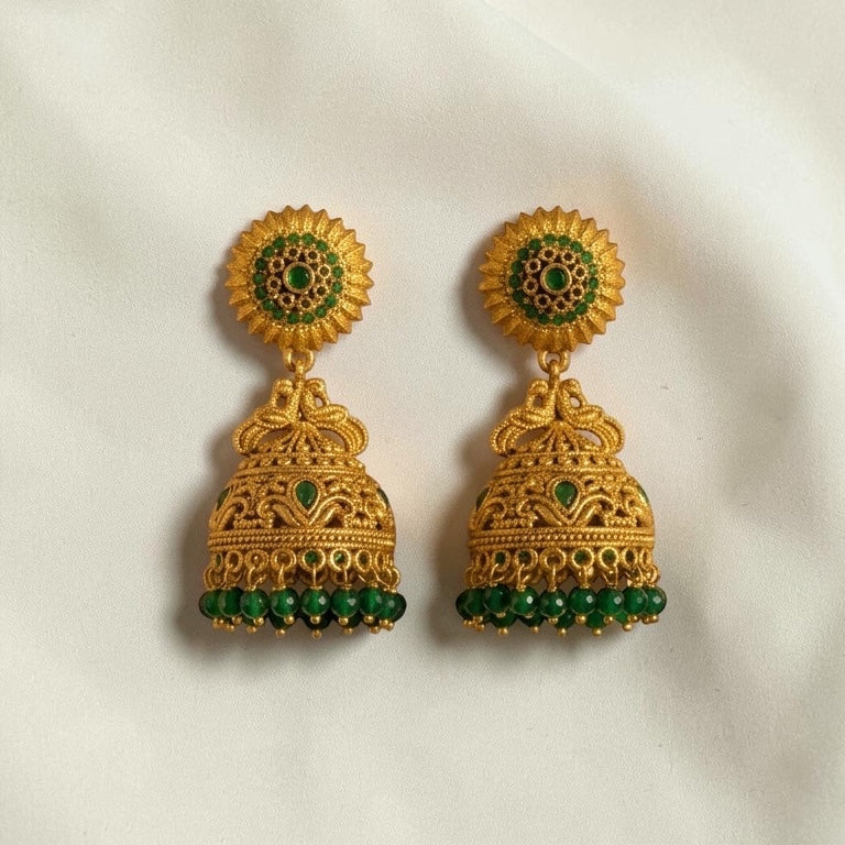 Lakx Fashion antique gold-tone brass jhumka earrings with green stone embellishments and beaded dome drops.