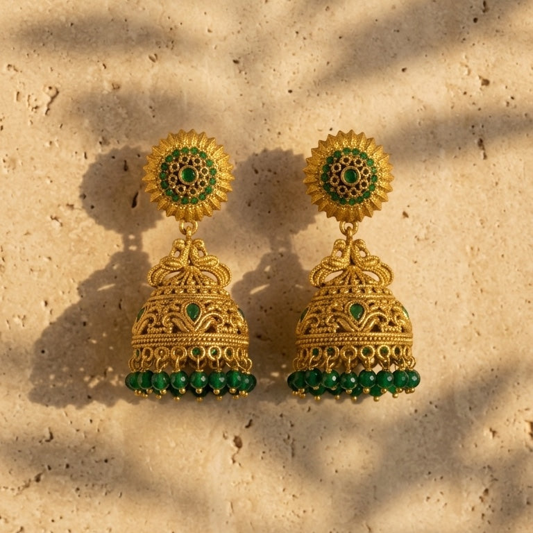 Lakx Fashion antique gold-tone brass jhumka earrings with green stone embellishments and beaded dome drops.