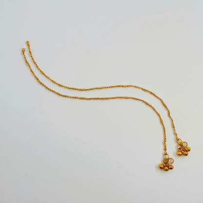Lakx Fashion gold-toned brass anklets featuring delicate link chains, cylinder beads, and small ghungroo bells.
