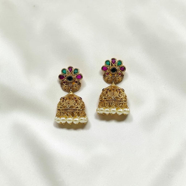 Lakx Fashion gold-tone brass jhumka earrings with floral studs, green and ruby stones, and dangling light yellow pearls.