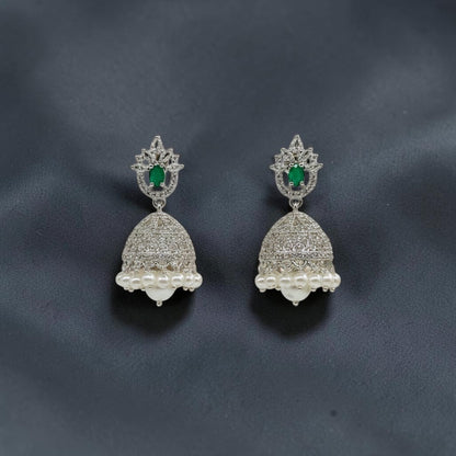 Lakx Fashion rhodium-tone jhumka earrings with green oval stones, white CZ accents, and dangling white pearls.