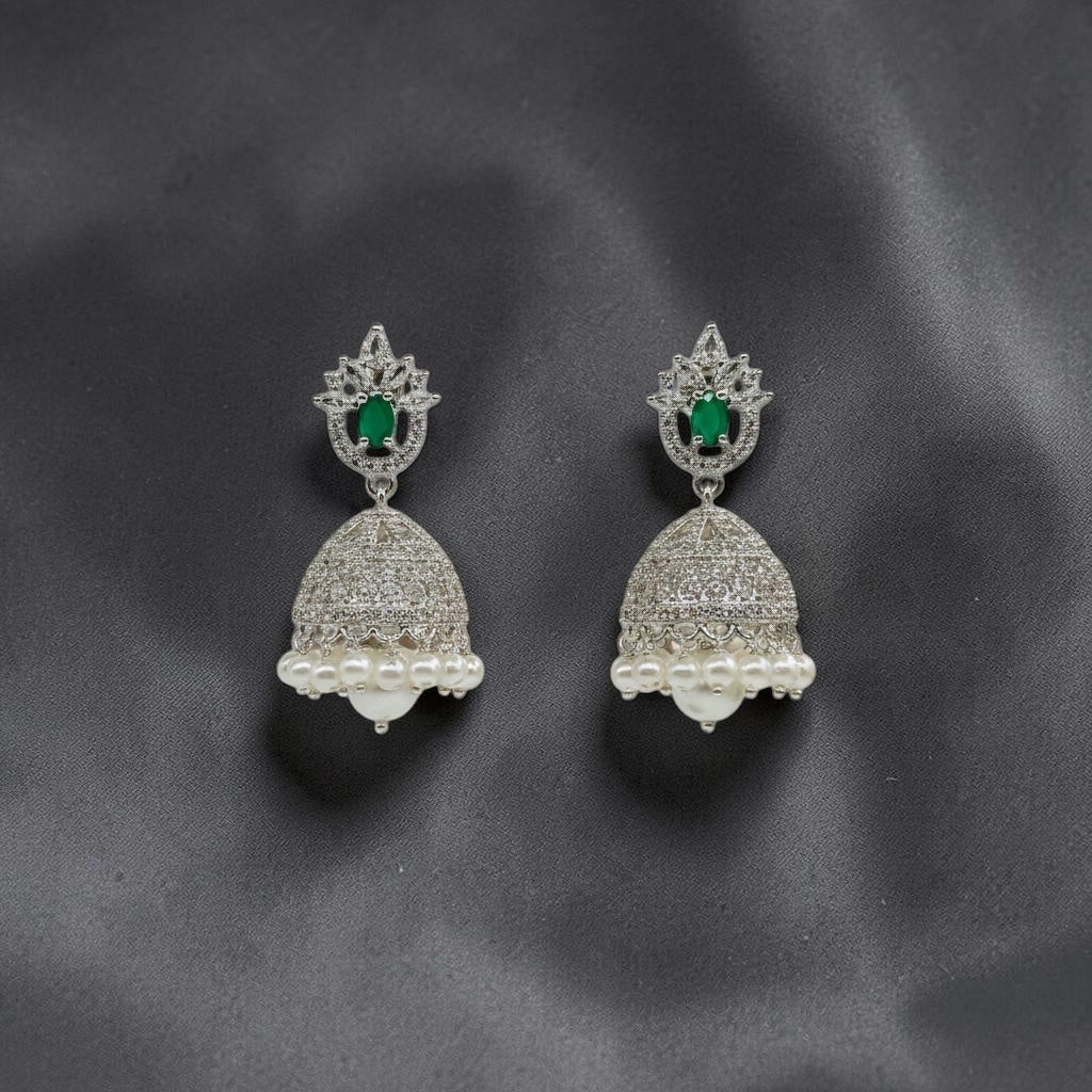 Lakx Fashion rhodium-tone jhumka earrings with green oval stones, white CZ accents, and dangling white pearls.