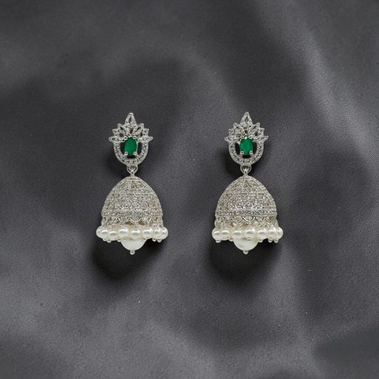 Lakx Fashion rhodium-tone jhumka earrings with green oval stones, white CZ accents, and dangling white pearls.