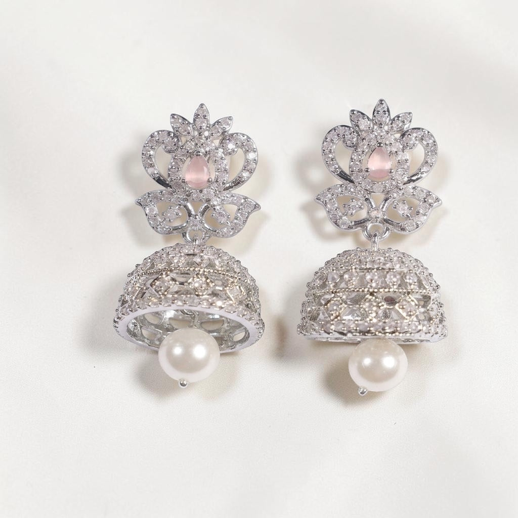 Lakx Fashion rhodium-tone jhumka earrings with pink oval stone, white CZ accents, and a dangling pearl drop.