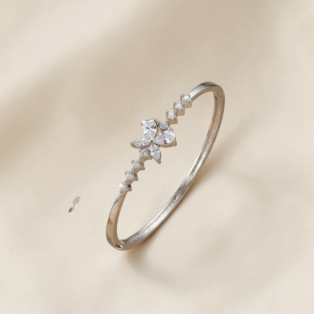 Lakx Fashion rhodium-tone brass bracelet with a floral marquise-cut white CZ stone motif on a neutral background