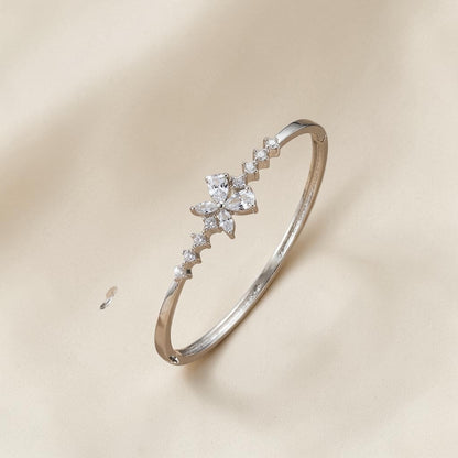 Lakx Fashion rhodium-tone brass bracelet with a floral marquise-cut white CZ stone motif on a neutral background