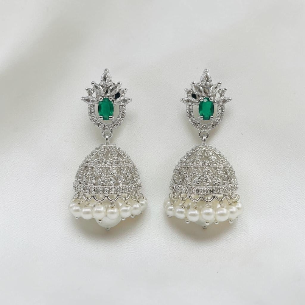 Lakx Fashion rhodium-tone jhumka earrings with green teardrop stones, white CZ accents, and hanging pearl drops.