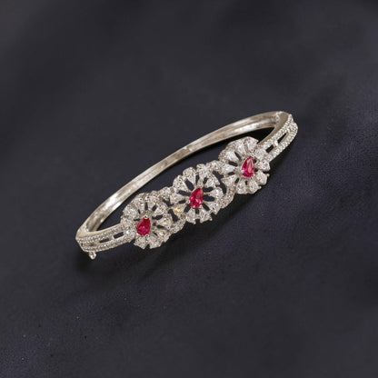 Lakx Fashion rhodium-tone brass bracelet with three floral clusters, pink marquise stones, and white CZ accents.