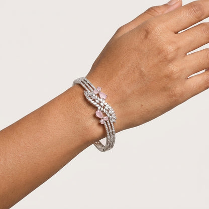 Lakx Fashion rhodium-tone brass bracelet with pink marquise stones and white CZ leaf-style clusters on a wrist